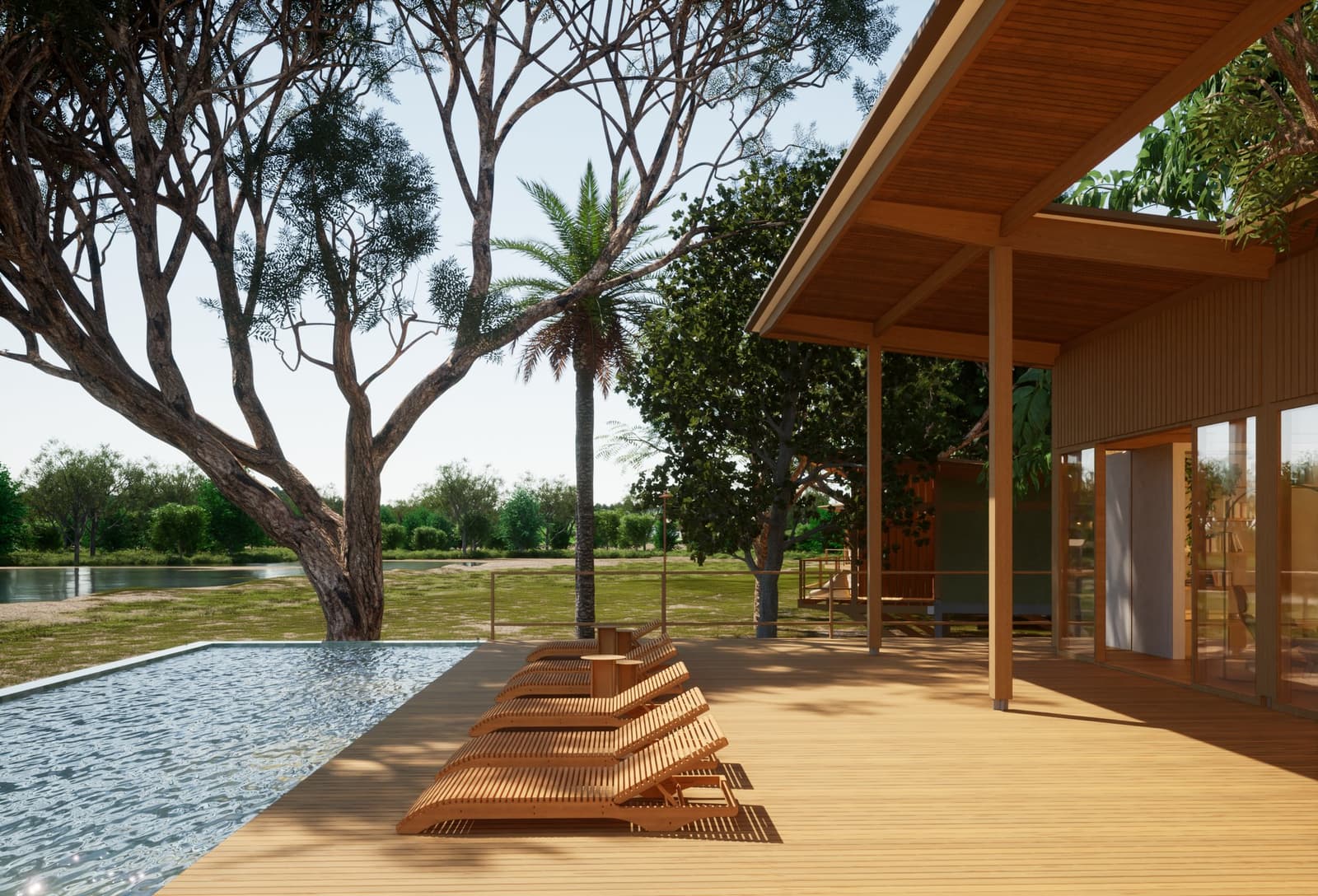 Safaris at dawn, cold drink by the pool by noon. This is how the Pantanal is best enjoyed. Photo: Lucio Fleury Wooden sun loungers lined up along an infinity pool deck on a luxury pantanal and amazon trip lodge, with native trees and a calm waterway visible beyond the timber-roofed veranda